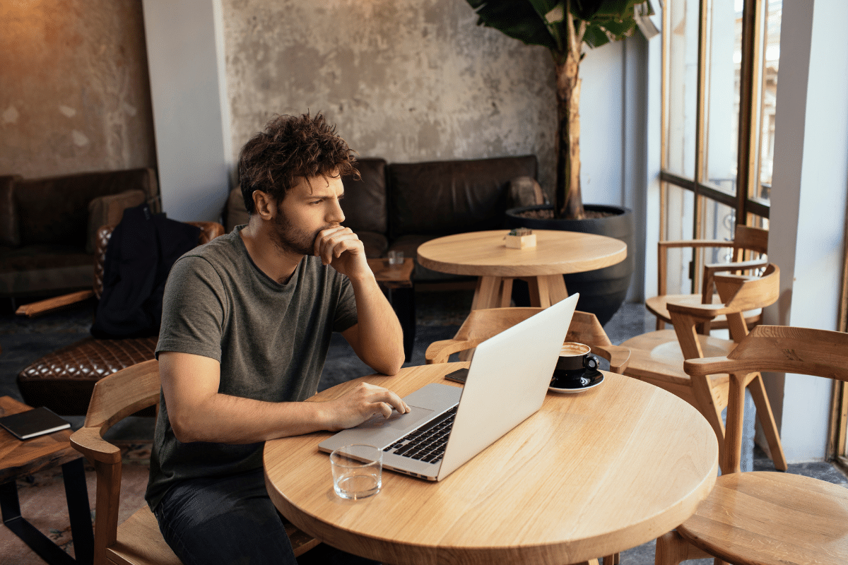 Freelancer looking at computer in co-working space