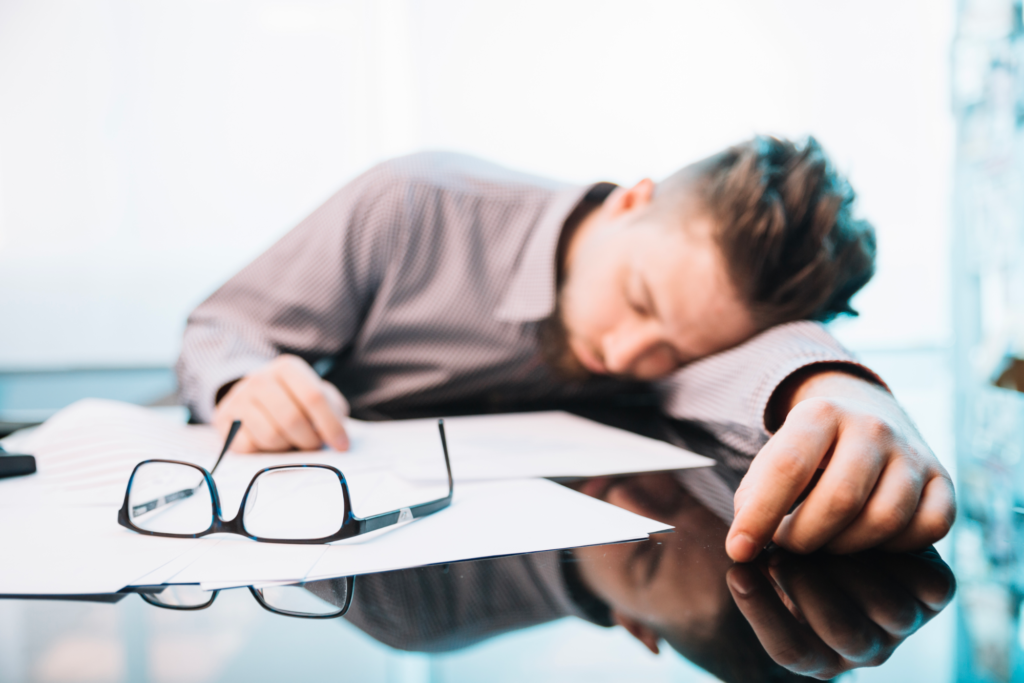 tired startup founder sleeping at desk
