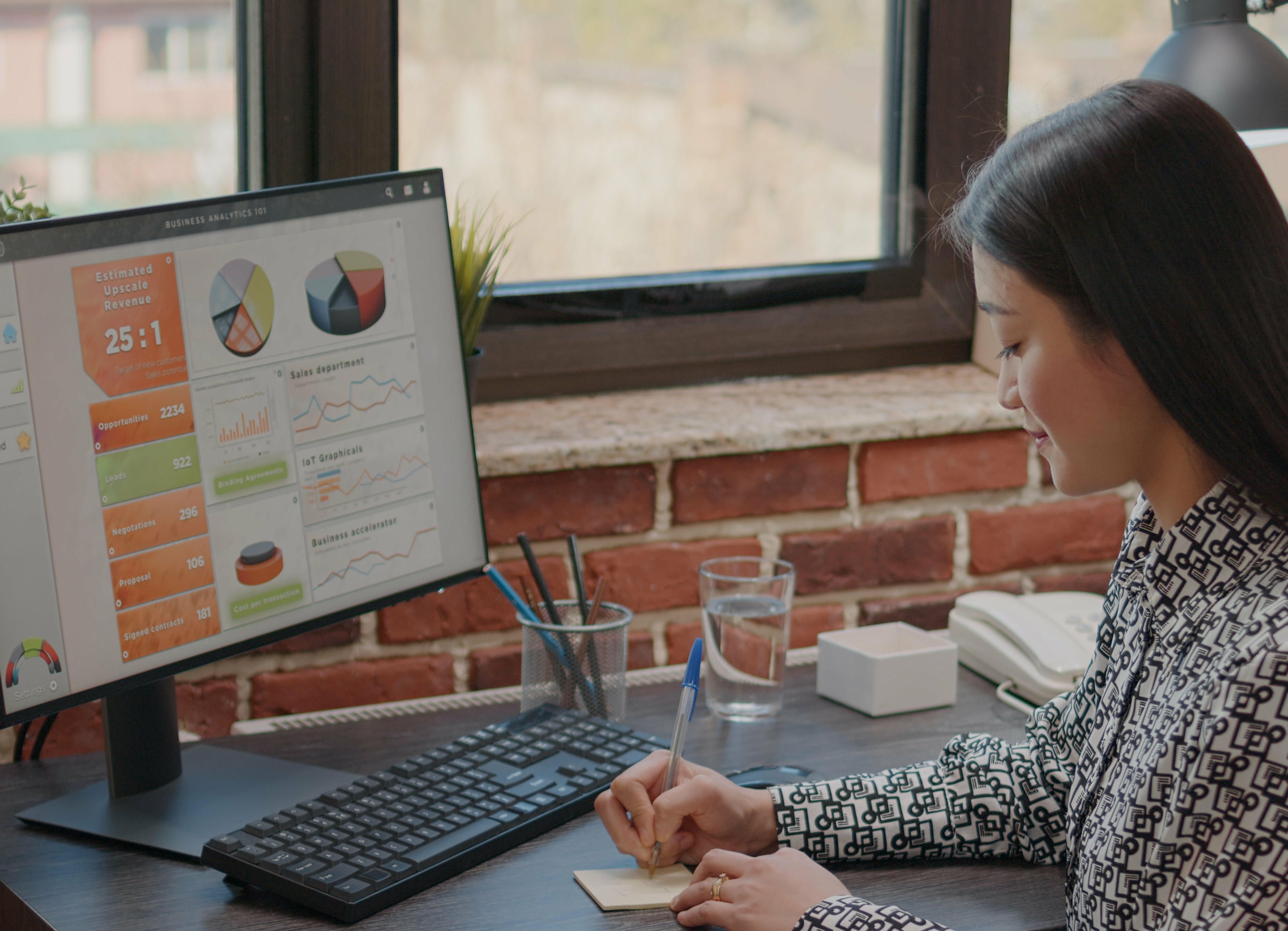 Person writing on sticky notes to remember task on computer. Business woman using post it memo paper as reminder to work on project planning for company efficiency and inspiration.