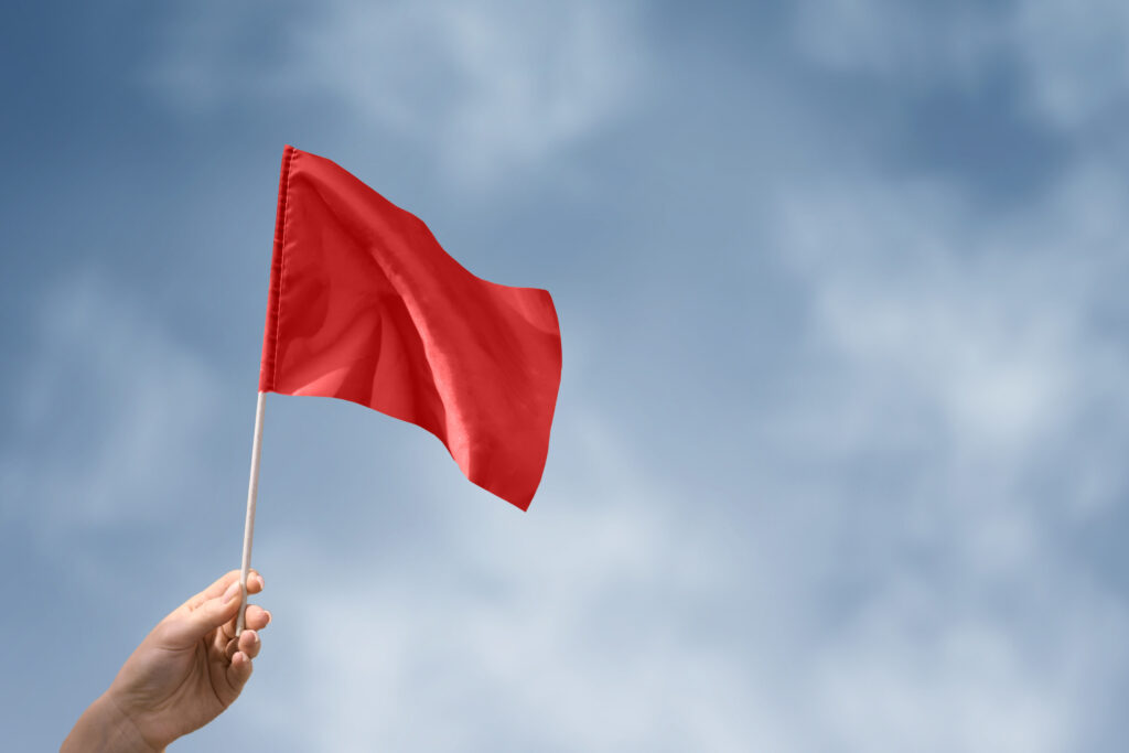 person holding a red flag