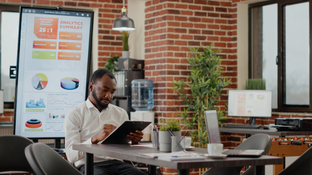 Black man looking at a business plan