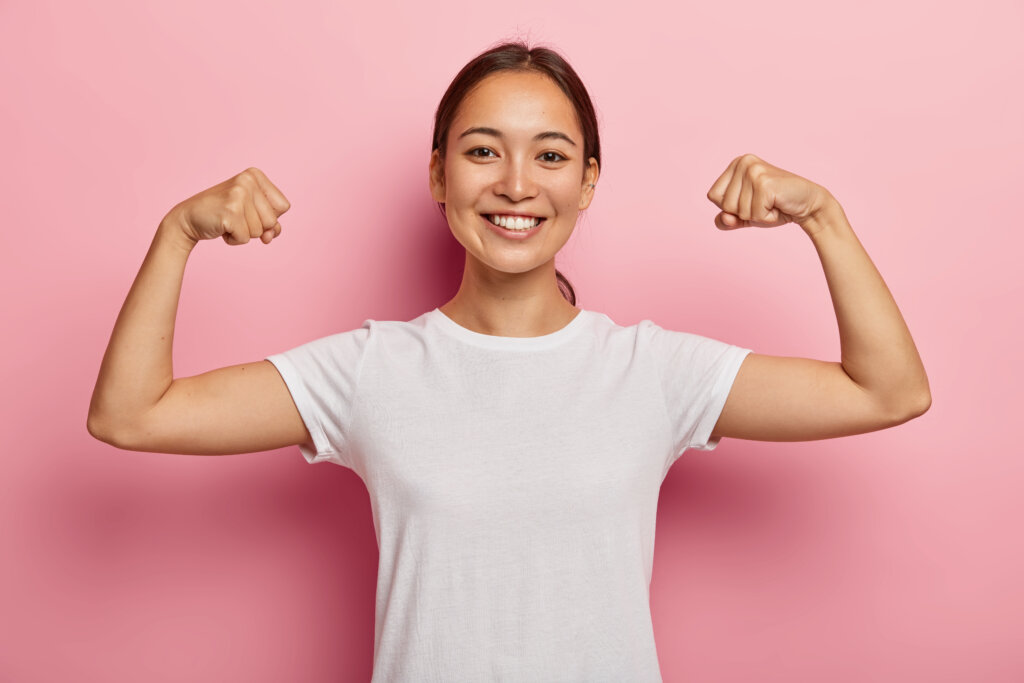 Woman flexing her arms showing empowerment