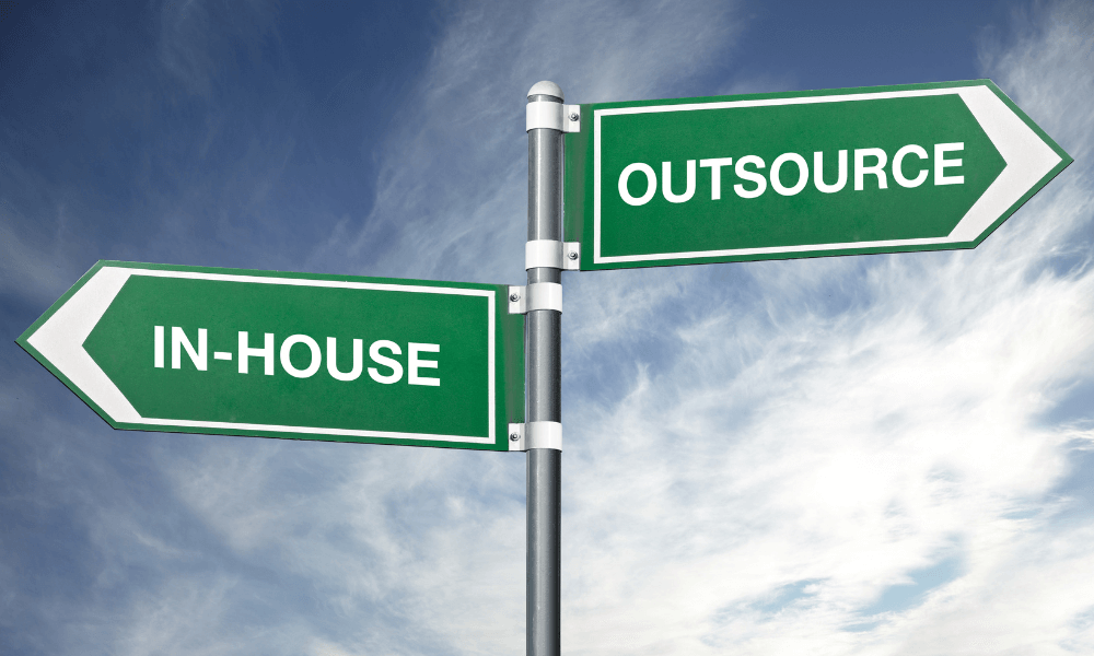 Sign that says in house and outsource