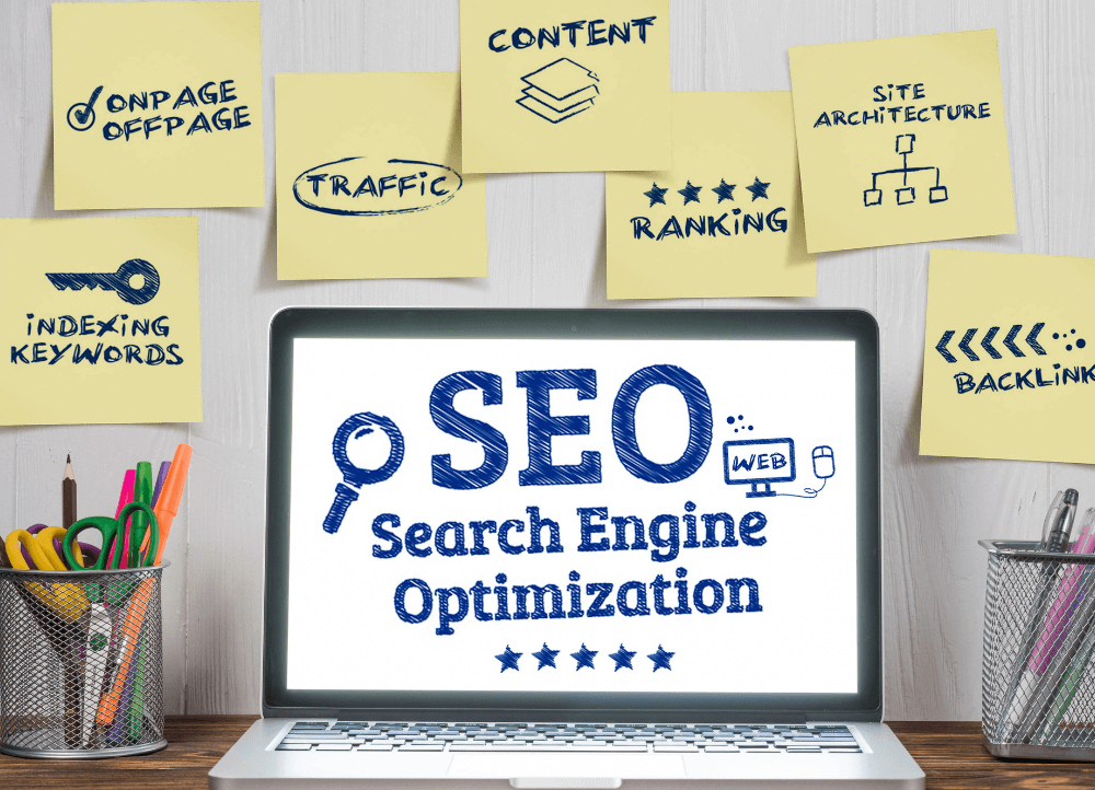 sticky notes with seo practices and a laptop in the center with SEO on the screen