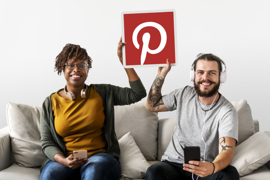 Couple showing a Pinterest icon