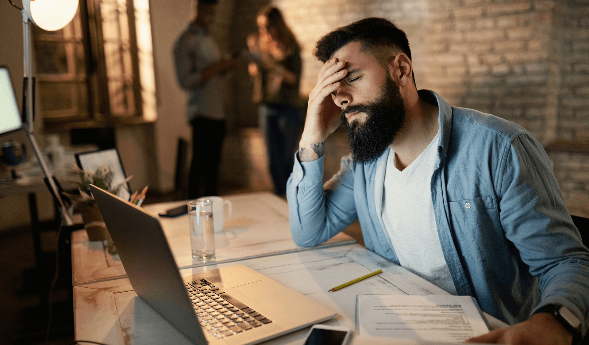 Startup founder looking stressed and overwhelmed with challenges